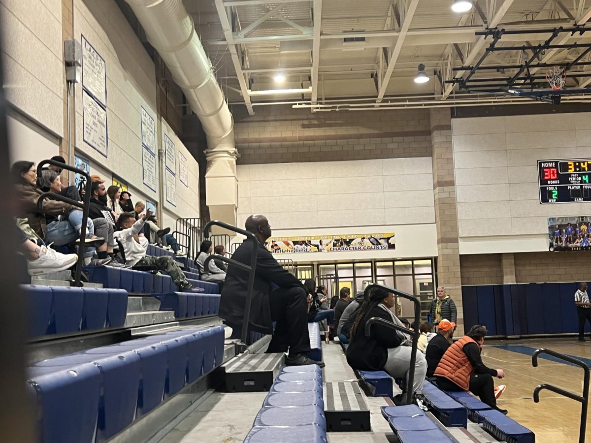Sidelines consisting mostly of parents at a regular season LACES Basketball game. 
